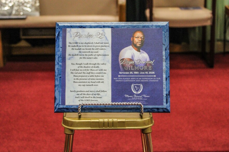 A plaque of Lloyd Gilmore is displayed during his funeral at Cornerstone Baptist Church in Sikeston, Missouri, on June 26. Hundreds of mourners gathered in honor of Gilmore, who died in police custody. (Cara Anthony/KFF Health News)