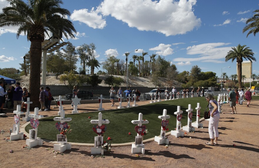 FILE - People visit a makeshift memorial for victims of the Oct. 1, 2017, mass shooting in Las Vegas, Sunday, Sept. 30, 2018, in Las Vegas.