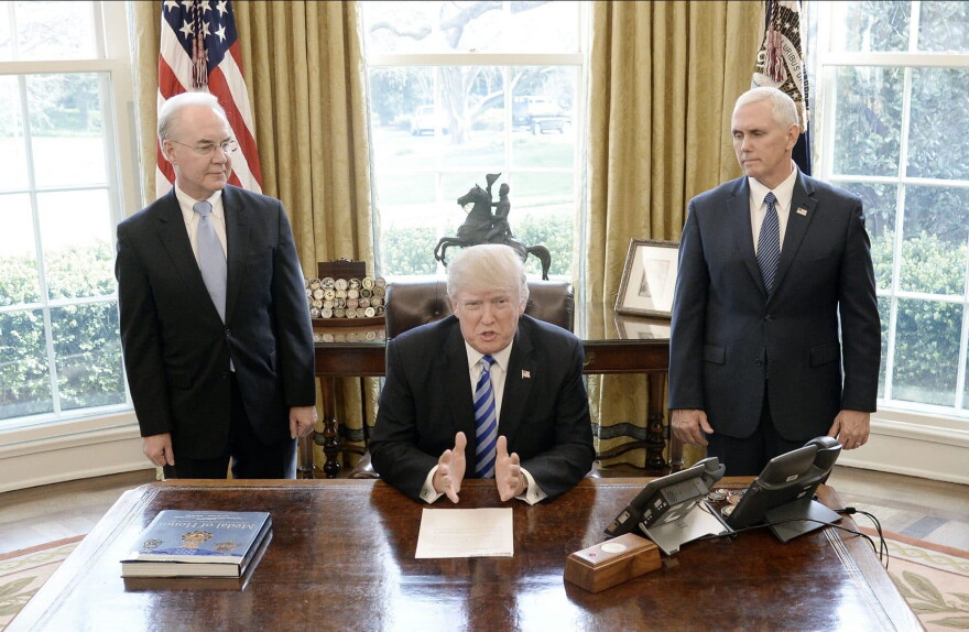 President Donald Trump reacts with HHS Secretary Tom Price (left) and Vice President Mike Pence (right) after Republicans abruptly pulled their health care bill from the House floor, in the Oval Office of  the White House on March 24, 2017 in Washington. (Olivier Douliery-Pool/Getty Images)