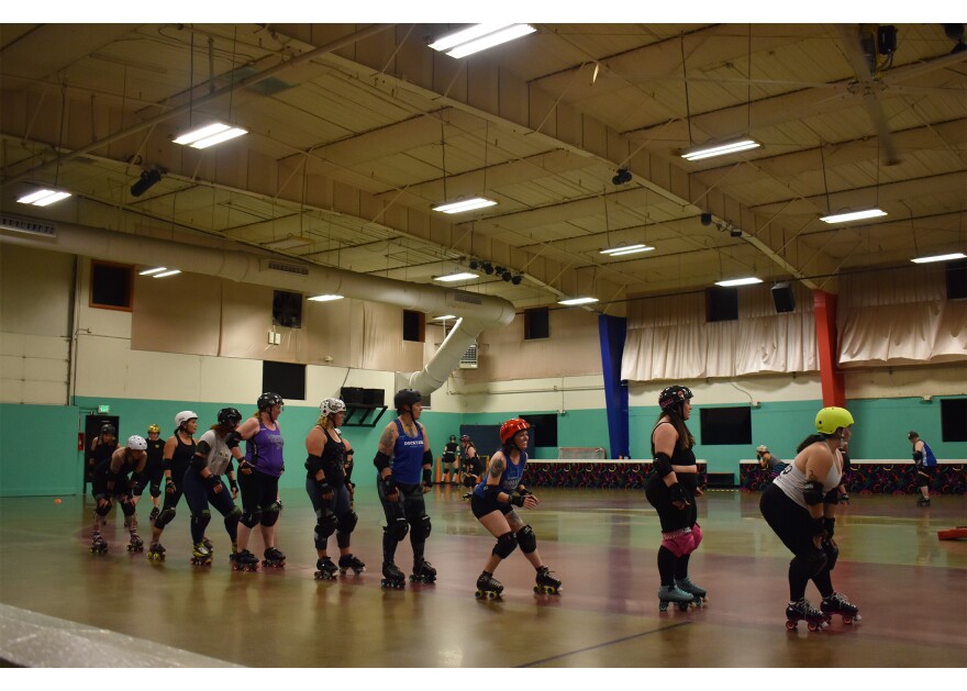 At the Dockyard Roller Derby league practice, skaters drill moving within different lanes on the track. // Lauren Gallup NWPB