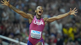 Sha'Carri Richardson, of the United States, celebrates after winning the gold medal in the final of the Women's 100-meters during the World Athletics Championships in Budapest, Hungary, Aug. 21, 2023.