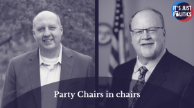 On the left is a monochromatic photo of Curtis Hertel. On the right is a monochromatic photo of Jim Runestad. At the bottom is an opaque, semi-circle with the words "Party Chairs in chairs". In the top right corner is the It's Just Politics logo.