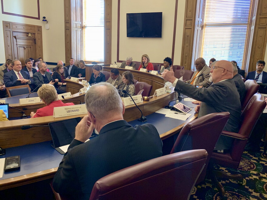 House Ways and Means Chair Tim Brown (R-Crawfordsville), right, discusses the surplus spending bill in committee.