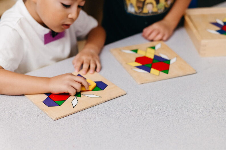 A child plays with a colorful puzzle. 