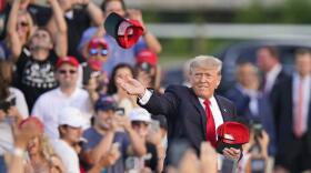 Former President Trump throwing hats