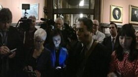 Reporters wait outside closed door leaders meeting at Governor Cuomo's office.