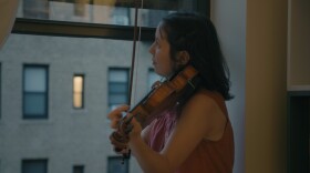 Violinist and Composer Evelyn Petcher Brandes in a video featuring her composition that pays tribute to essential workers and the nightly salute New Yorkers gave them in the early days of the Covid pandemic.