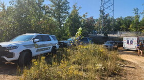 Law enforcement vehicles parked as manhunt for 32-year-old Joseph Couch continues
