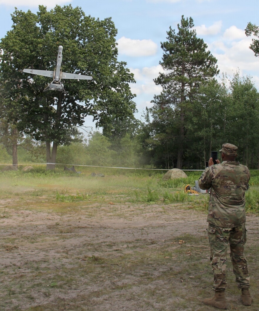 Sgt. 1st Class Benjamin Dowing, innovation noncommissioned officer, Detachment 6, Support Group, 75th U.S. Army Reserve Innovation Command observes a vertical takeoff and landing or VTOL, unmanned aerial system as it conducts a vertical landing during Northern Strike 26-2 as part of his evaluation and assessment mission, at Observation Point 5, Camp Grayling, Mich., Aug. 4, 2026. NS 26-2 is an Army-sponsored, multi-component, multinational exercise designed to build readiness and enhance interoperability with allied forces to fight and win. The annual event is Michigan’s largest and longest military exercise designed to validate readiness of the joint reserve force, was held Aug. 1-15, 2026, at the National All-Domain Warfighting Center and featured approximately 9,000 participants.