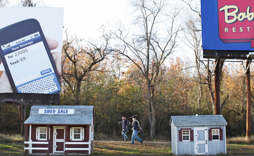 Brent Feito and Lars Prillaman walk through a place where Union campsites were established during the winter of 1862-63, in Stafford County, Va.