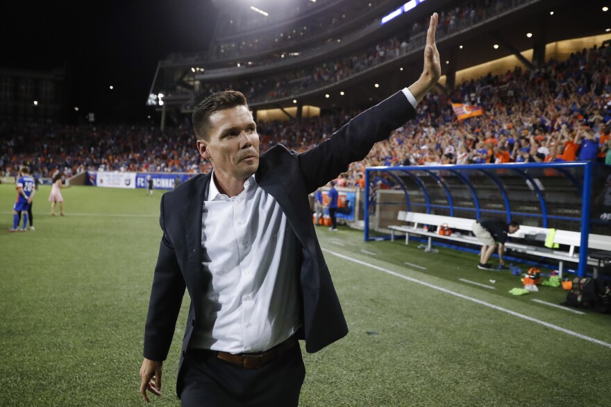 FC Cincinnati head coach Alan Koch waves to the crowd after winning a U.S. Open Cup soccer match against the Chicago Fire in June 2017 in Cincinnati. 