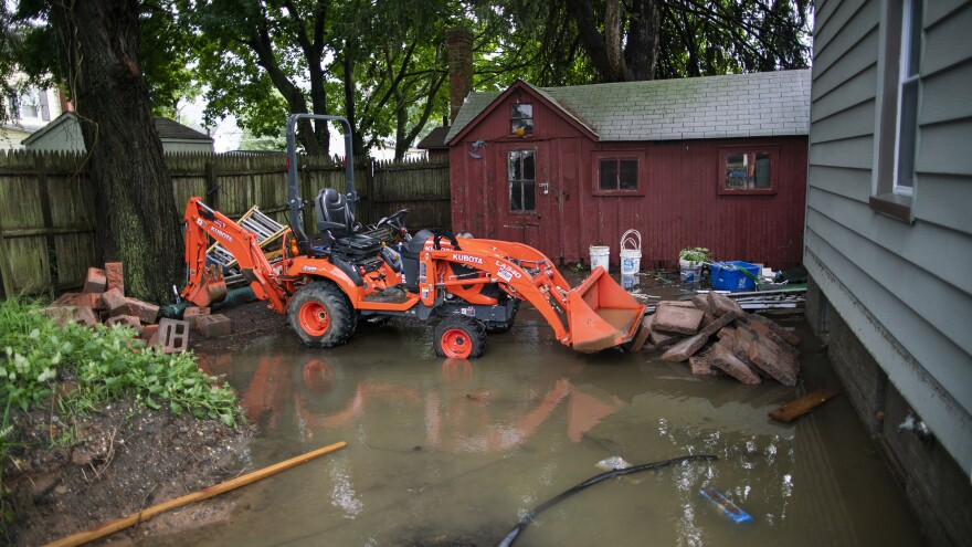 The back yard of a house in Helmetta, N.J., is seen partially flooded on Monday after being hit by Tropical Storm Henri.