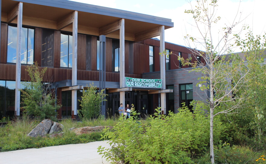 A family walks out of Rock Ridge High School in Virginia on the day of the open house, Aug. 27, 2026.