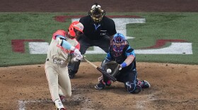 American League's Jarren Duran, of the Boston Red Sox, hits a home run during the fifth inning of the MLB All-Star baseball game, Tuesday, July 16, 2024, in Arlington, Texas. Anthony Santander, of the Baltimore Orioles, also scored. (AP Photo/Tony Gutierrez)