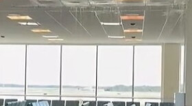 Water cascades from the ceiling in Terminal D at RSW Saturday after a bolt on a chilled water line broke. An airport official said Sunday that the line was quickly fixed and cleanup nearly completed.