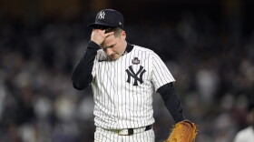 New York Yankees starting pitcher Clarke Schmidt walks back to the dugout after throwing against the Los Angeles Dodgers during the second inning in Game 3 of the baseball World Series, Monday, Oct. 28, 2024, in New York. (AP Photo/Godofredo A. Vásquez)
