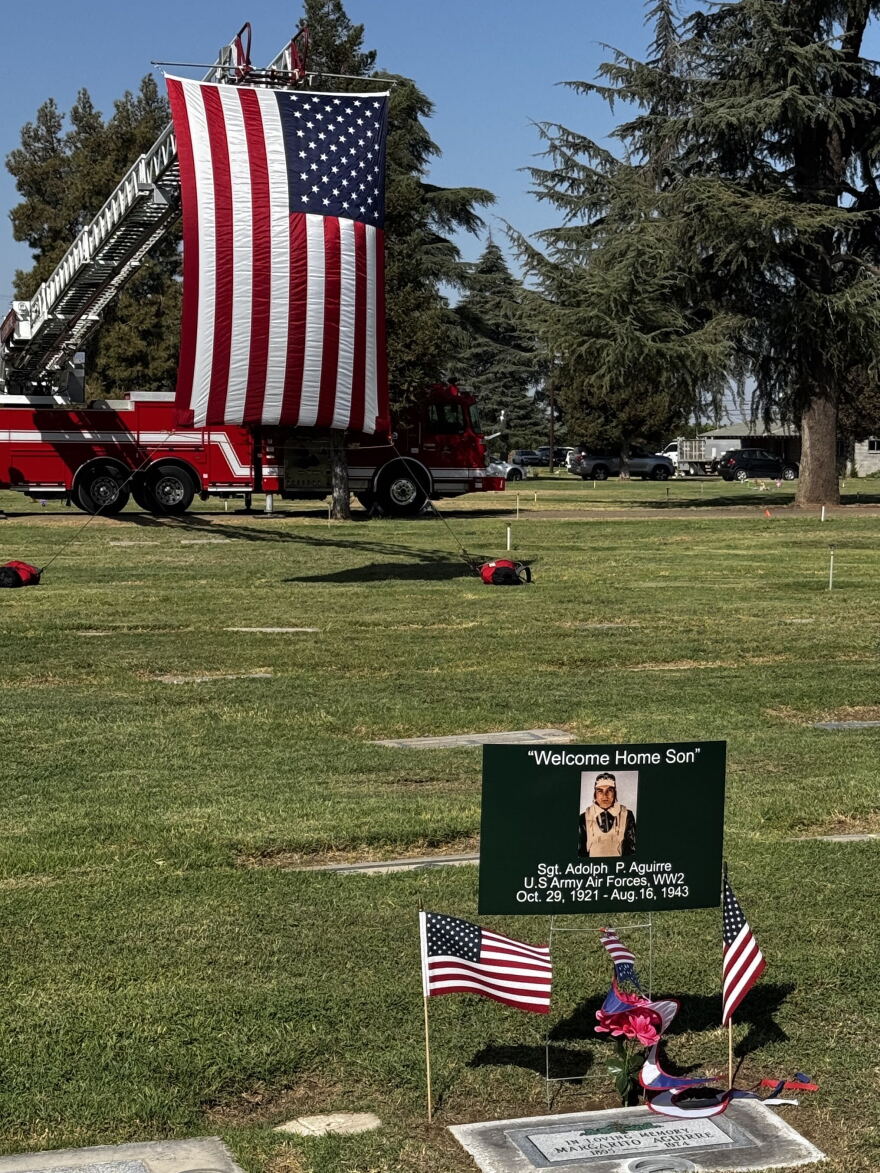 Poster that says, "Welcome home son." American flag in the background.
