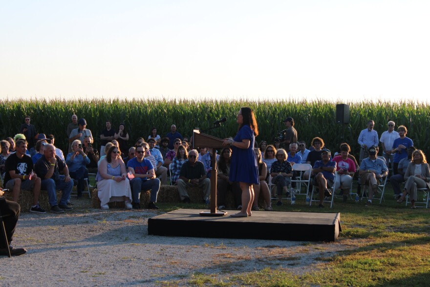 Illinois state Rep. Sharon Chung speaking to crowd at outdoor campaign event in McLean County.