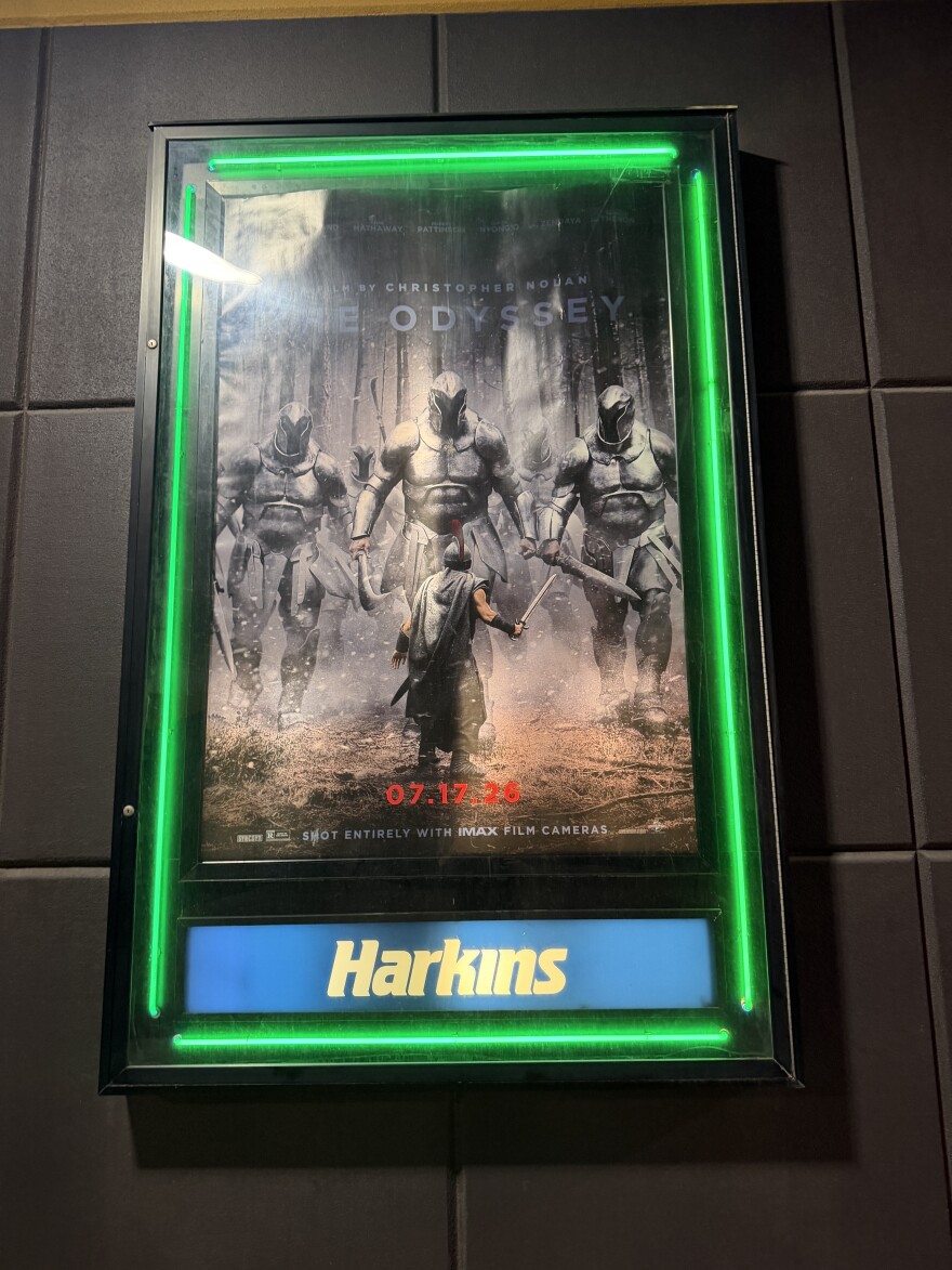 The Odyssey IMAX 70 mm poster at Arizona Mills after dark