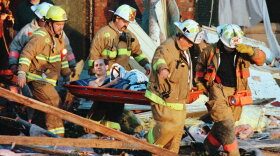 Bernie Franks is taken from the wreckage of his home by firefighters in Montgomery, Ohio, just north of Cincinnati, early Friday morning, April 9, 1999 after his neighborhood was hit by high winds. 
