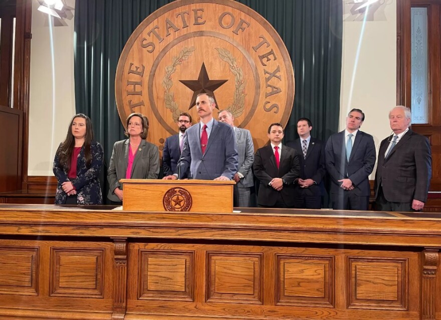 Rep. Andrew Murr, the chairman of the impeachment board of managers, stands behind a podium while answering questions from reporters on Monday. Murr and the members of the board will be tasked with building the case in the Texas Senate's trial of Attorney General Ken Paxton.