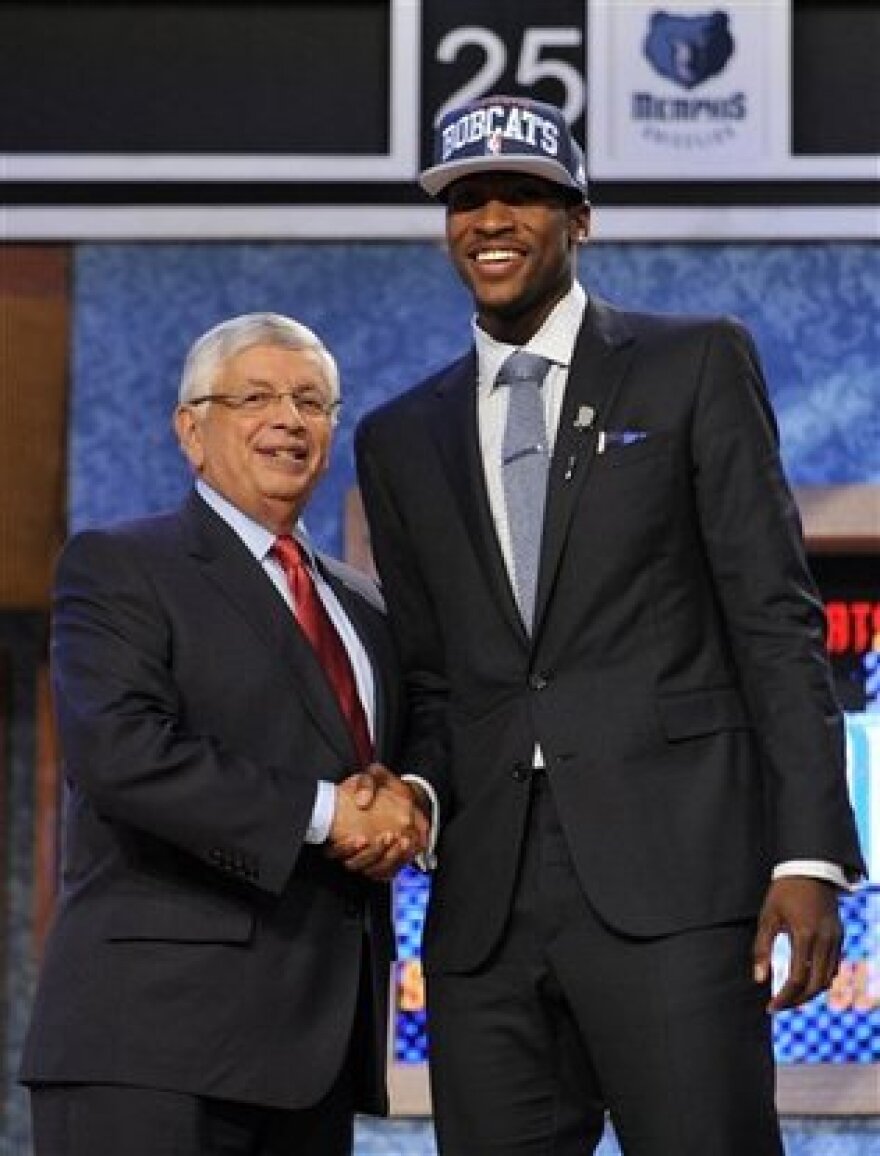 NBA Commissioner David Stern, left, poses with the No. 2 overall draft pick Michael Kidd-Gilchrist, of Kentucky, who was