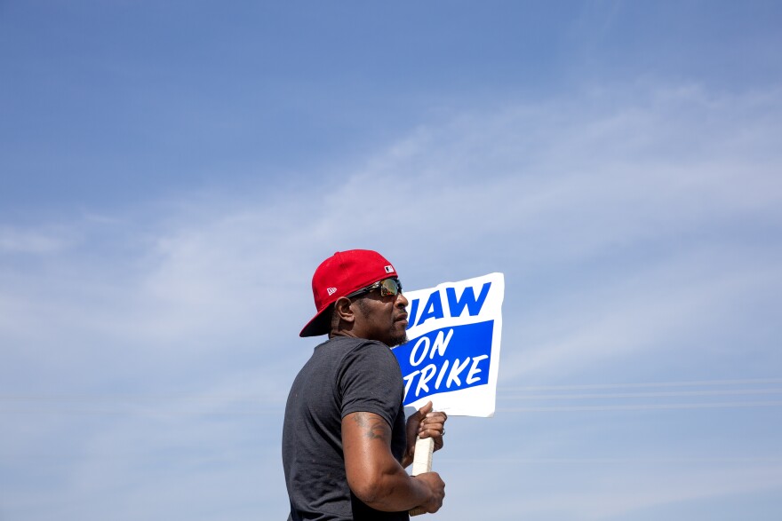 Antoine Huey attends the picket line on Day 5 of the United Auto Workers strike against the Big Three automakers, on Tuesday, Sept. 19, 2023, outside of the General Motors Assembly Plant in Wentzville, Mo. Despite the Wentzville GM plant production workers voting against the deal, the contract between UAW and the automaker passed nationally giving long-time workers a raise of about 33%. Some newer workers and temps will see their pay more than double.