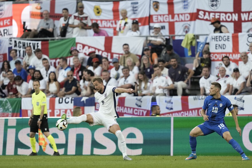 Scarves aloft Ali Samaniego, at left, and Veronica Brewer, celebrate at a region-wide watch party for the Final Draw. In the countdown to the FIFA World Cup 26, the event drew a crowd Friday morning to KC Live! in the Power & Light District.