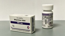 A white box with purple accents that reads Mifepristone Tablet, 200 mg.