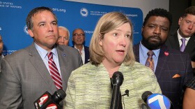 Mayor Nan Whaley (D-Dayton) speaks to reporters after the US Conference of Mayors luncheon, flanked by Mayor Andrew Ginther (D-Columbus, left) and Mayor Tito Brown (D-Youngstown).