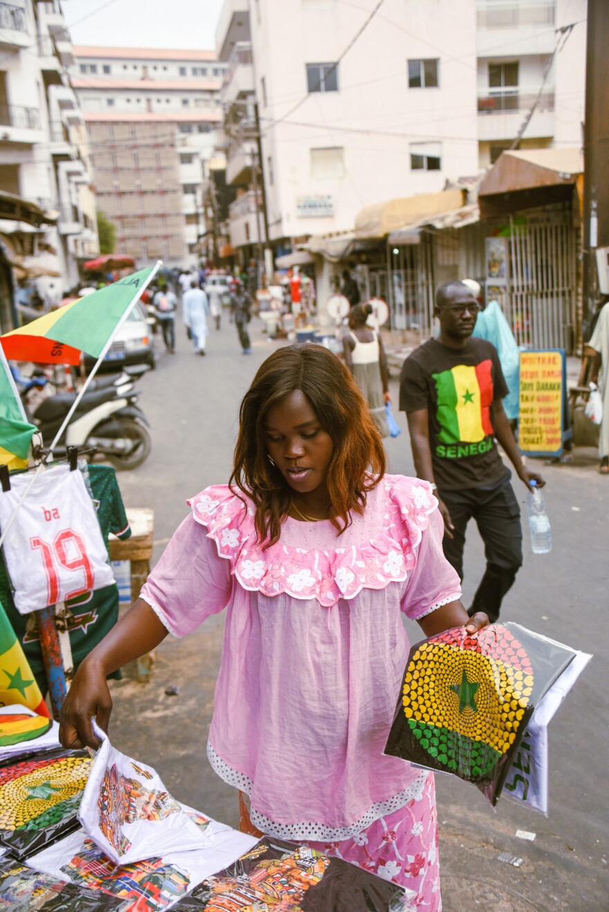 Mame Fatou Dieng sells jerseys, T-shirts, flags and other Senegal team paraphernalia in Dakar's Sandaga Market.