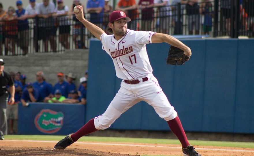 Florida State pitcher Mike Compton throws the ball in the first inning of Saturday's game against Florida in Gainesville.