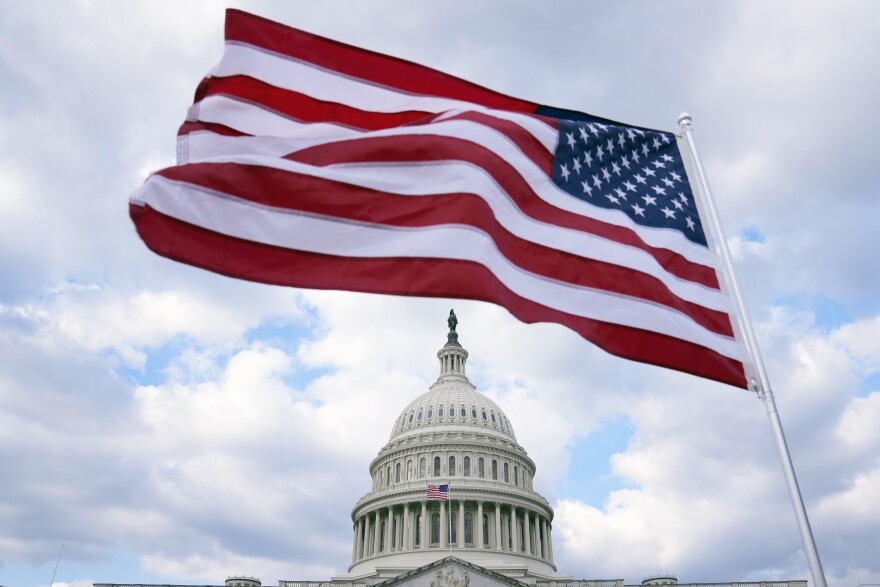 The U.S. Flag flies at the Capitol in Washington, Monday, Feb. 6, 2023. President Joe Biden on Tuesday night will stand before a joint session of Congress for the first time since voters in the midtem elections handed control of the House to Republicans. (AP Photo/Mariam Zuhaib)