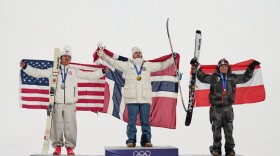 From left, silver medalist United States' Mac Forehand, gold medalist Norway's Tormod Frostad and bronze medalist Austria's Matej Svancer celebrate after the men's freestyle skiing big air finals at the 2026 Winter Olympics, in Livigno, Italy, Tuesday, Feb. 17, 2026.