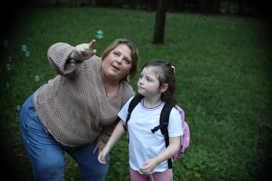 Angela Hausman plays with Everly, age 7, who she is in the process of adopting, on October 14, 2026, in Olathe, Kansas. Everly’s mom, Angela’s best friend of 20 years, died last year.