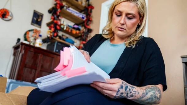 Haley Ness examines paperwork from her time as an Adult Protective Services investigator in Pierce County. She took on complex and high-profile investigations into abuse, neglect, and exploitation of vulnerable adults.