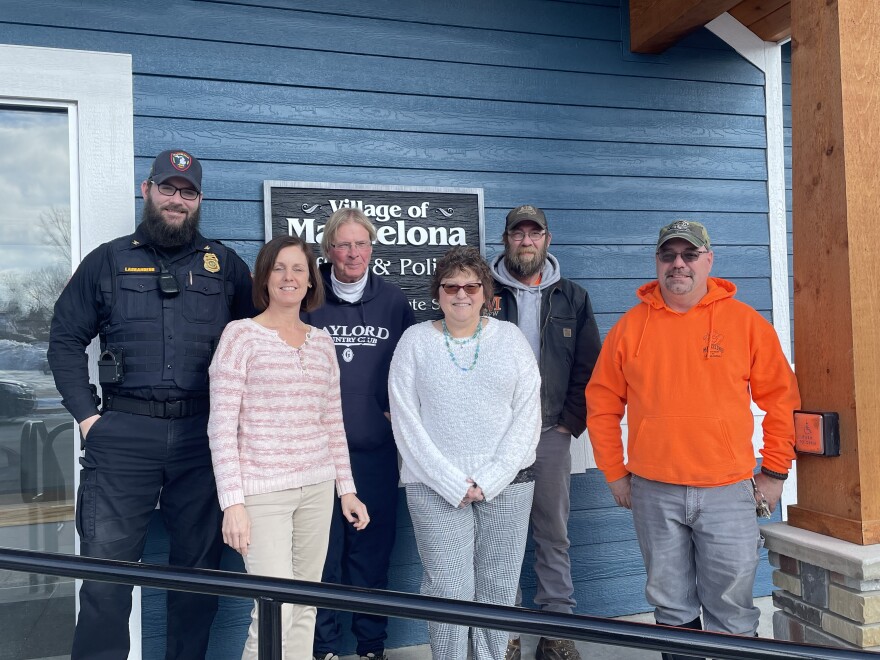 Some of Mancelona's Village Hall staff, village president Mike Allison is center, residents and public works employees Jamie Fisher and Craig Hart to the end on right.
Photo CreditL: Tyler Thompson