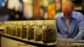 <p>Jars full of medical marijuana are seen at a medical marijuana dispensary in Los Angeles. U.S. attorneys sent letters telling more than a dozen of the shops to shut down.</p>