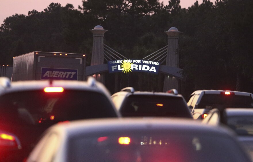 Traffic backs in the north-bound lanes of Interstate 75 near the Georgia-Florida state line as people flee Hurricane Irma Friday, Sept. 8, 2017, in Jennings, Fla.. (AP Photo/John Bazemore)