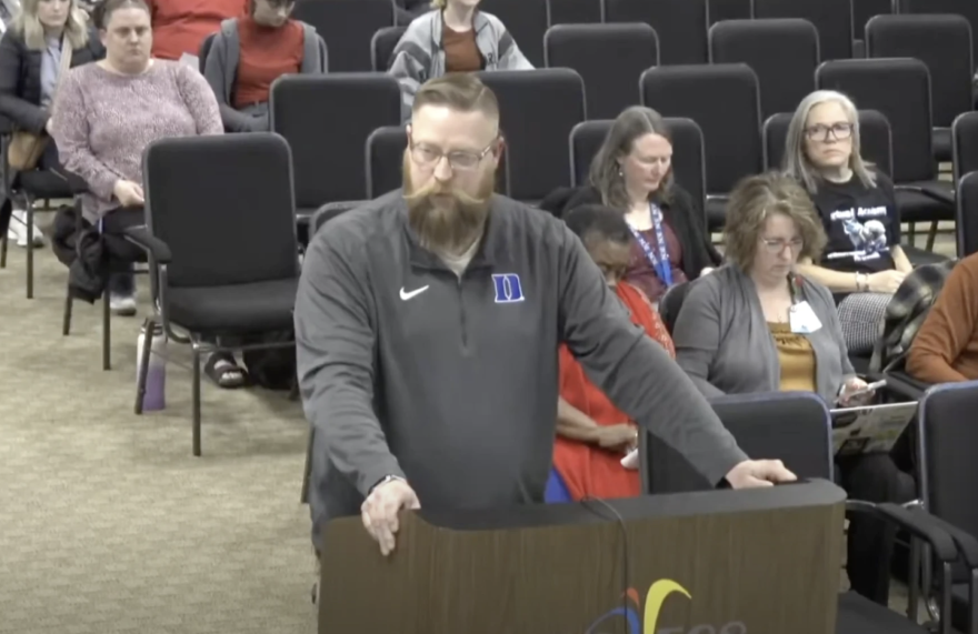 Ronald Jason Lucero speaks at a school board meeting in 2025.