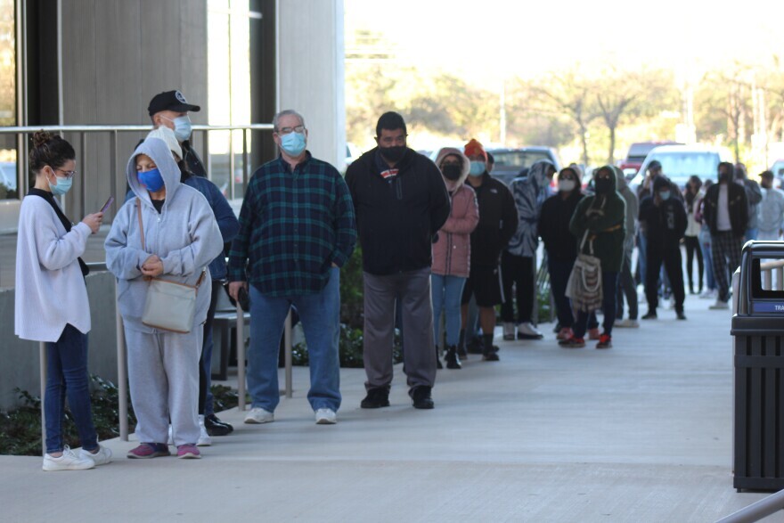 At least 130 people wait in line at the Alamo Colleges District headquarters COVID-19 testing site on Jan. 6, 2022. Texans are seeing long wait times and delayed results amid a post-holiday surge in test demand.