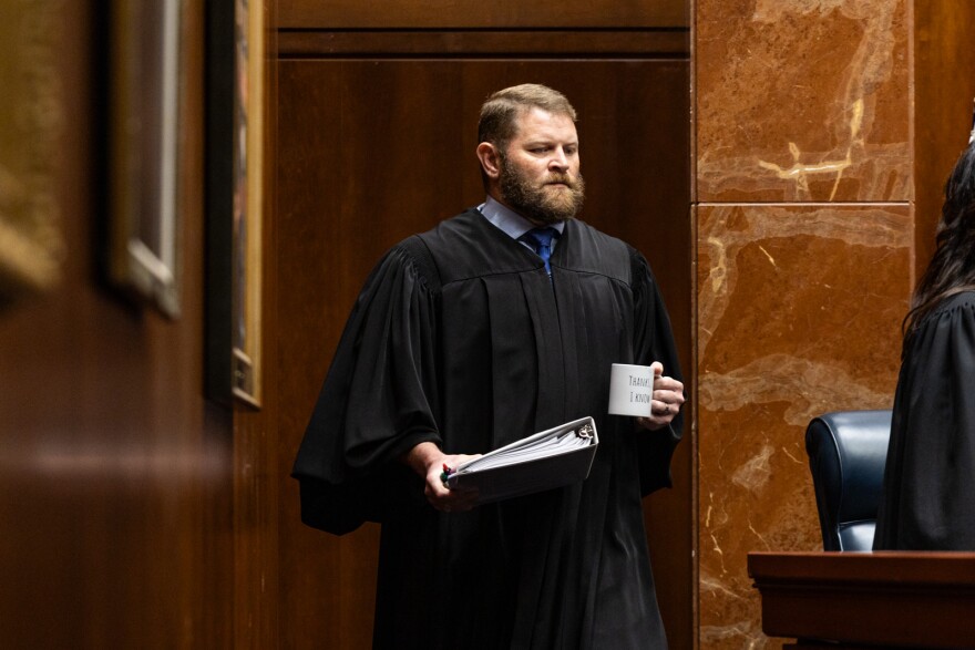 Justice James P. Sullivan enters the court before the oral argument for Sadie Weldon v. The Lilith Fund for Reproductive Equity at the Texas Supreme Court on Wednesday, January, 14, 2026. Patricia Lim/KUT News