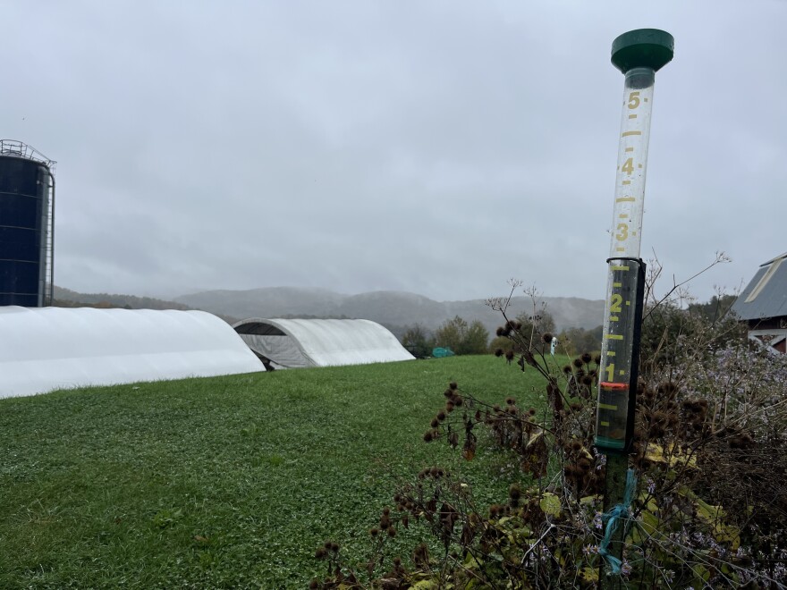 A rain gauge shows less than one inch of rain.