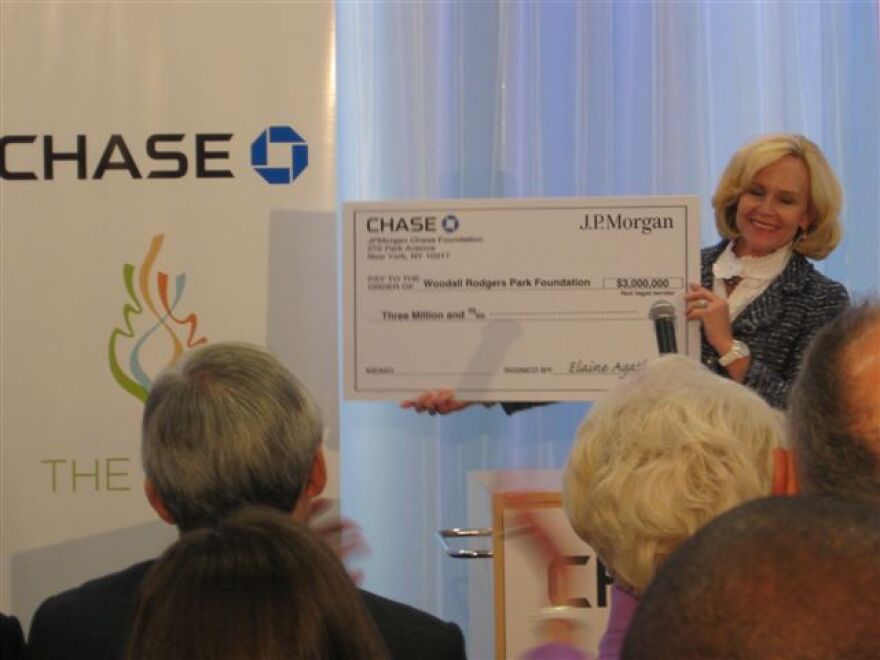 Elaine Agather, Chase Bank Dallas, presents check