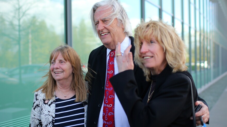 (From left) Margaret Aspinall of the Hillsborough Family Support Group, attorney Michael Mansfield and and Sue Roberts smile outside the courthouse after hearing the conclusions of the Hillsborough inquest Tuesday.