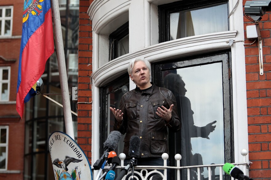 Julian Assange speaks to the media from the balcony of the Embassy Of Ecuador in London in 2017. The founder of the WikiLeaks website was forcibly removed from the embassy earlier this year and is fighting extradition to the U.S. to face charges related to the Manning leaks.