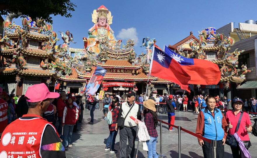 Supporters of Kuomingtang presidential nominee Han Kuo-yu ready for a campaign rally at a Hakka temple south of Taipei, the capital.