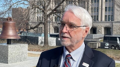 Timothy Killeen, president of the University of Illinois System, speaks to reporters outside of the Illinois State Capitol in Springfield.