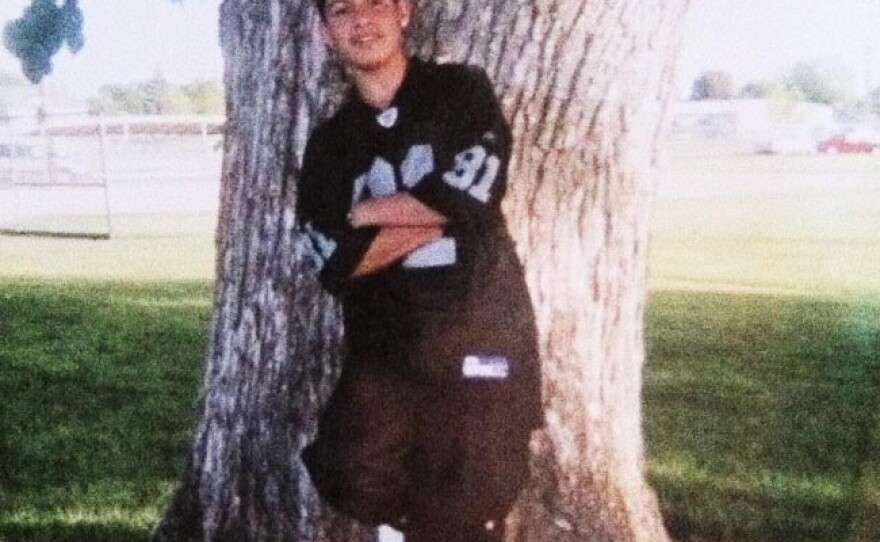 Alfonso Santos, age 14, wearing baggy pants and dark blue to represent his gang, the East Side Locos in of Caldwell, Idaho. He says he got rid of all his clothes when he decided to leave the gang.