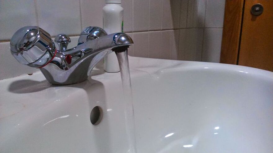 A picture of a running tap.